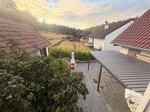 A residential area with multiple houses, each with a sloped roof and a small garden area. - Spessart Dream: 17 guests, 5 bedrooms, foosball, and a view of the valley in the nature park (Sinntal)