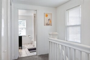 Upstairs hallway leading to the full bathroom - The Painted Porch | Tarentum (Tarentum)
