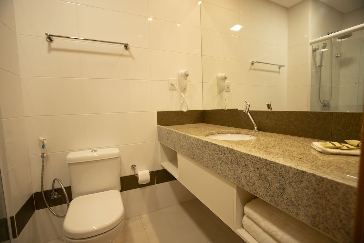 Refresh easily in a spotless bathroom with wide vanity space.