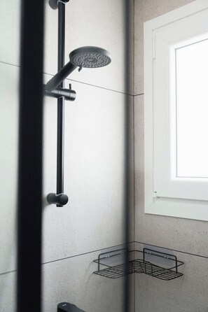 A modern shower with a handheld showerhead and a wall-mounted control panel. - Modern Central Studio Walk to Beach & Dining (Lemesos)