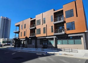 A multi-story building with balconies, large windows, and a modern architectural design. - The James Suite Two | New 2BR Beach Block (Atlantic City)