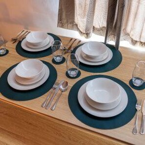 A dining table set with plates, glasses, and cutlery. - Darlington - House - Central Location - Sleeps 6 (Darlington)