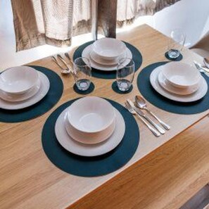 A dining table set with plates, glasses, and cutlery. - Darlington - House - Central Location - Sleeps 6 (Darlington)