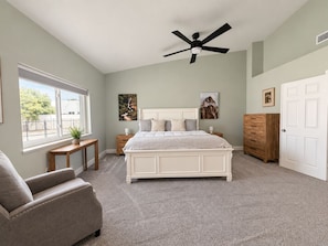 A bedroom with a bed, a ceiling fan, a nightstand, a dresser, a chair, and a window. - 4 Bedroom Retreat with Pool, hot tub, outdoor kitchen, arcades, sleeps 12 (Mesa)