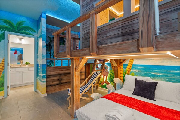 A bedroom with a bunk bed, a hammock, and a beach-themed mural. - Sophisticated New Home Near Disney (2592SN) (Kissimmee)