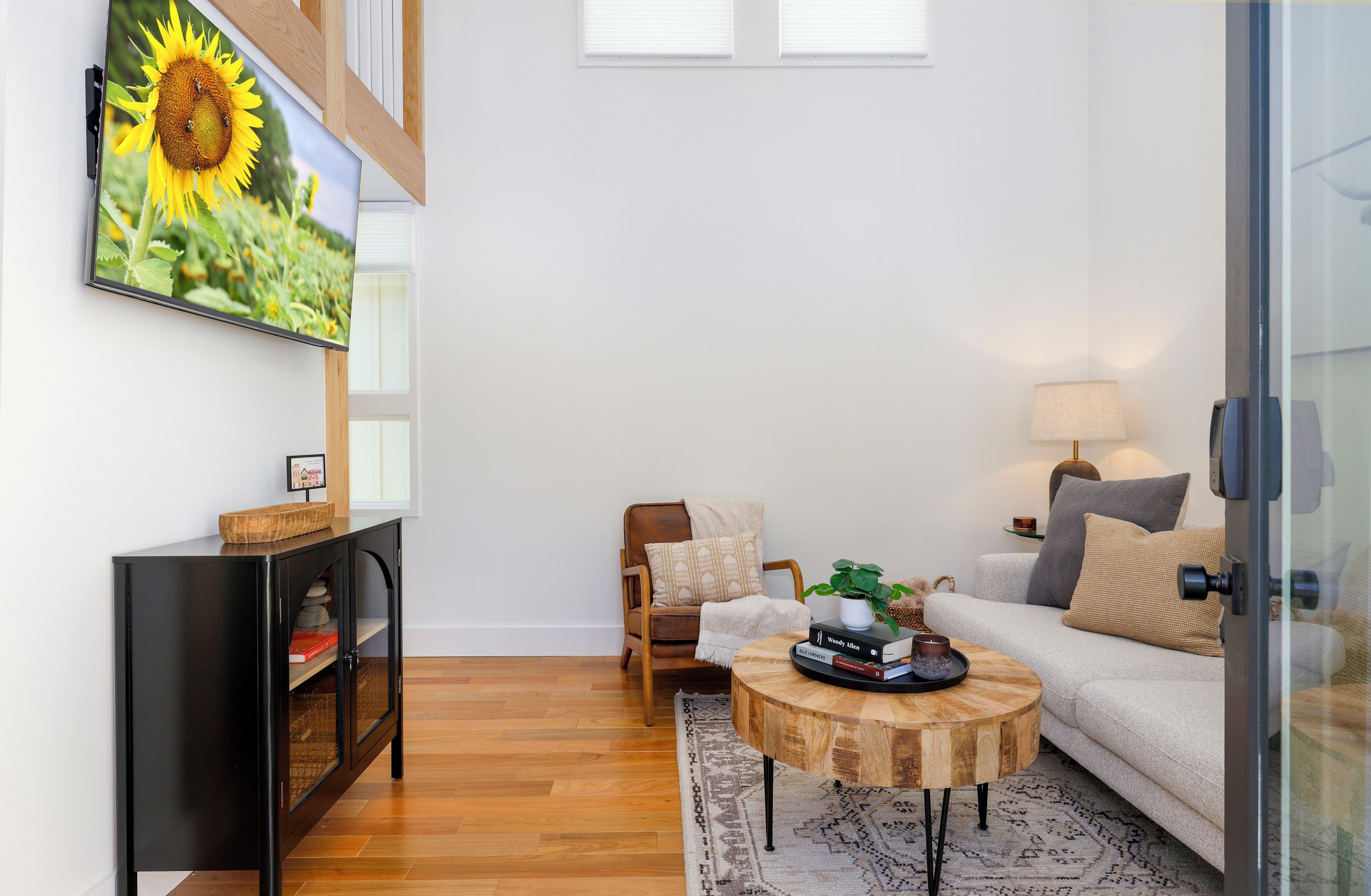Comfortable living room with natural light and a large tv
