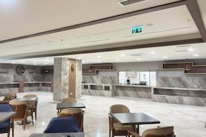 A spacious lobby with marble flooring, a reception desk, and seating areas. - Vienna House by Wyndham Istanbul Bahcelievler (Istanbul)