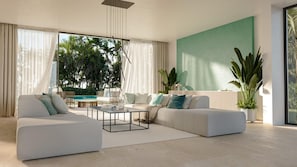 Un moderno salón con un sofá modular, una mesa de centro y vistas a una piscina y zonas verdes.