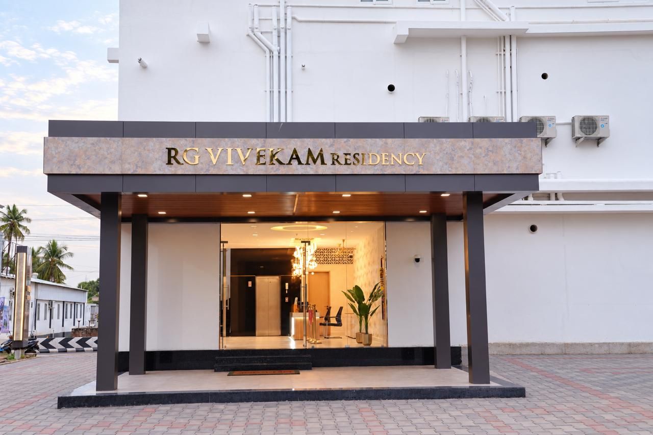 A modern building with a sign reading 'RGVIVEKAM RESIDENCY.'