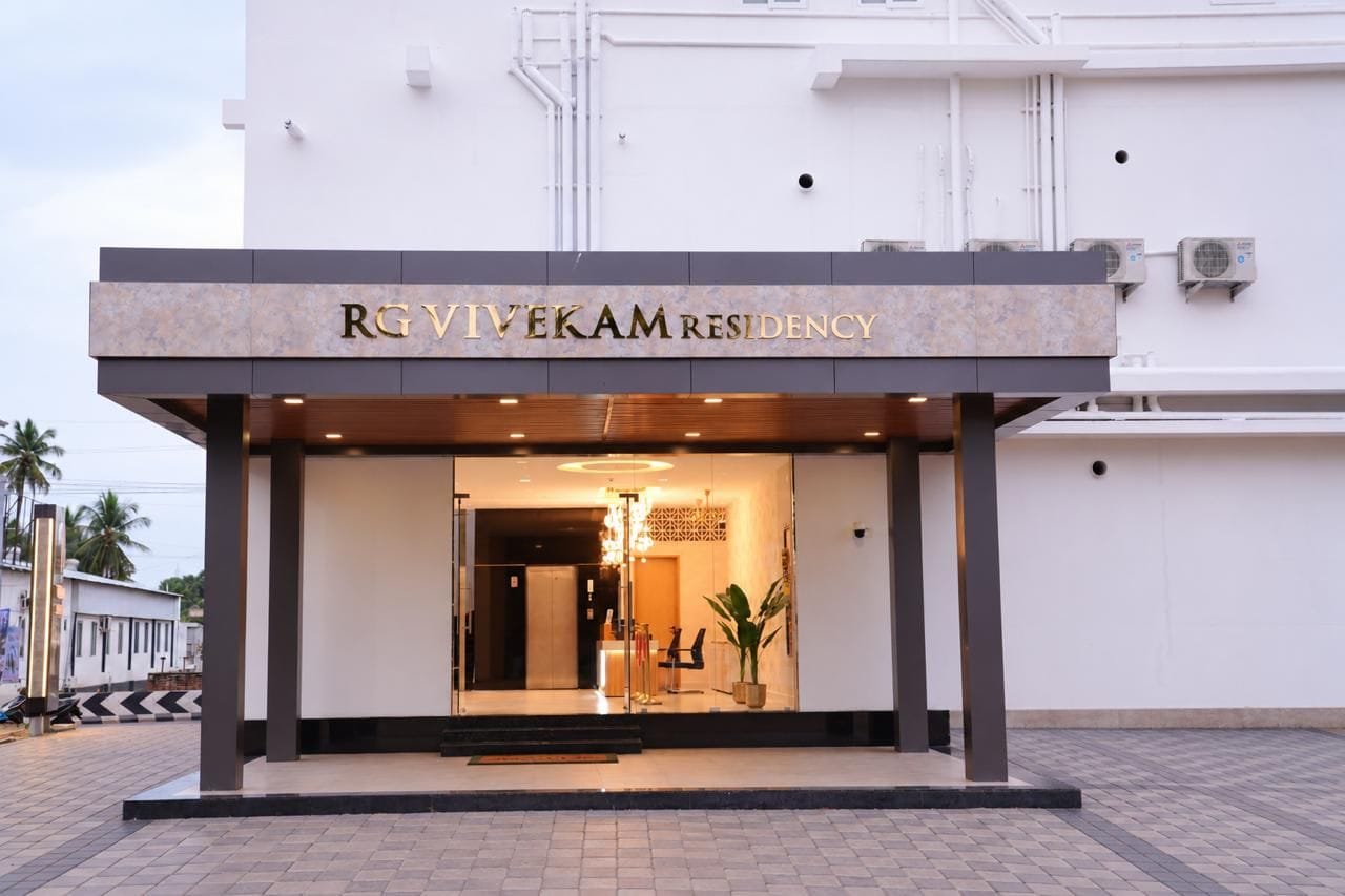 A modern building with a sign reading 'RGVIVEKAM RESIDENCY'.