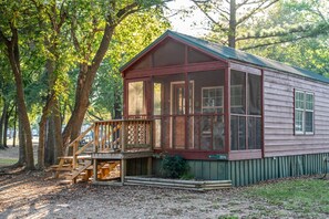 A wooden cabin with a porch, large windows, and a number '354' sign. - Bungalow Cabin Studio - Sleeps 4 to 6 guests. (Gore)
