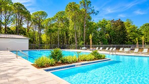 A swimming pool with a 2 FT 6 IN depth, surrounded by lounge chairs and a paved deck. - Sandestin Cottage on Raven Golf Course: 3 En-Suite BR, Golf Cart, Pool (Miramar Beach)