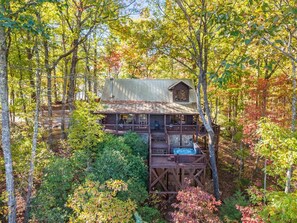A cabin with a wooden deck and a hot tub, surrounded by trees. - The Nook - Mountain Views - Hot tub  - Dogs  - Hiking (Blue Ridge)