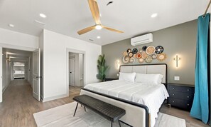 A serene bedroom to recharge between memorable adventures. - 8BR Beach House | Heated Pool + Pickleball (Gulf Shores)