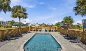 Palm trees and sparkling water make relaxation irresistible. - 4BR Coastal Retreat | Heated Pool + Pickleball (Gulf Shores)