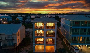 Twilight brings a magical glow to your surroundings. - 4BR Coastal Home| Heated Pool + Pickleball (Gulf Shores)