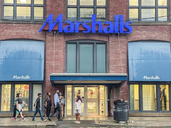A storefront with the name 'Marshalls' prominently displayed.