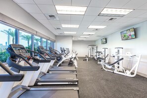 A gym with treadmills, weight machines, and a TV on the wall. - Presidential Penthouse 3 Bdrm available 4 your Raiders vs. Rams Football game! (Las Vegas)