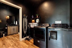 A compact kitchen with a washing machine, a dryer, and a small refrigerator. - Family Reunion Ranch Near Zion: 4 Homes, Sleeps 26 (Kanab)