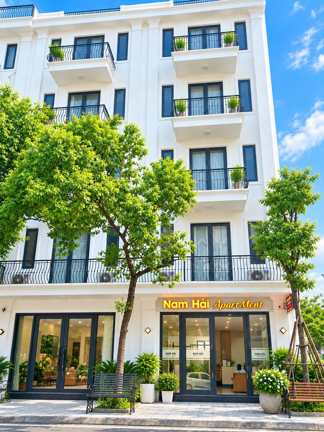 A multi-story building with a sign reading 'Nam Hai Apartment.'