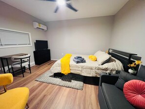 A bedroom with a bed, a desk, a chair, and a sofa. - Charming Gold Suite - Entire Guest Unit-Tempe & ASU (Tempe)