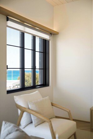 A room with a large window overlooking a body of water and greenery. - Architect-Designed 3-Bed by Bondi Beach (Bondi Beach)