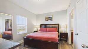 Master bedroom with king bed and TV + ensuite bathroom (sleeps 2) - Lagoon Lullaby 614-Gulf Views & Bunks-Sleeps 6 (Panama City)