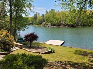 A lakeside property with a dock, a small shed, and a grassy area with a tree. - N Lake Dr on Whitewater Lake (Salem)