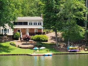 A house with a dock and kayaks by a lake, surrounded by trees. - N Lake Dr on Whitewater Lake (Salem)