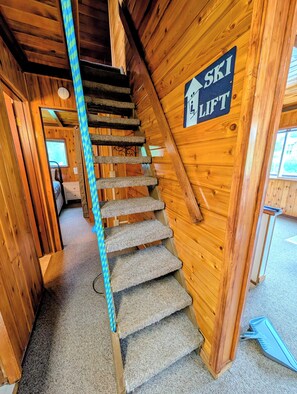 A wooden staircase with a sign indicating a ski lift. - Cozy Chalet in the Heart of Girdwood (Anchorage)