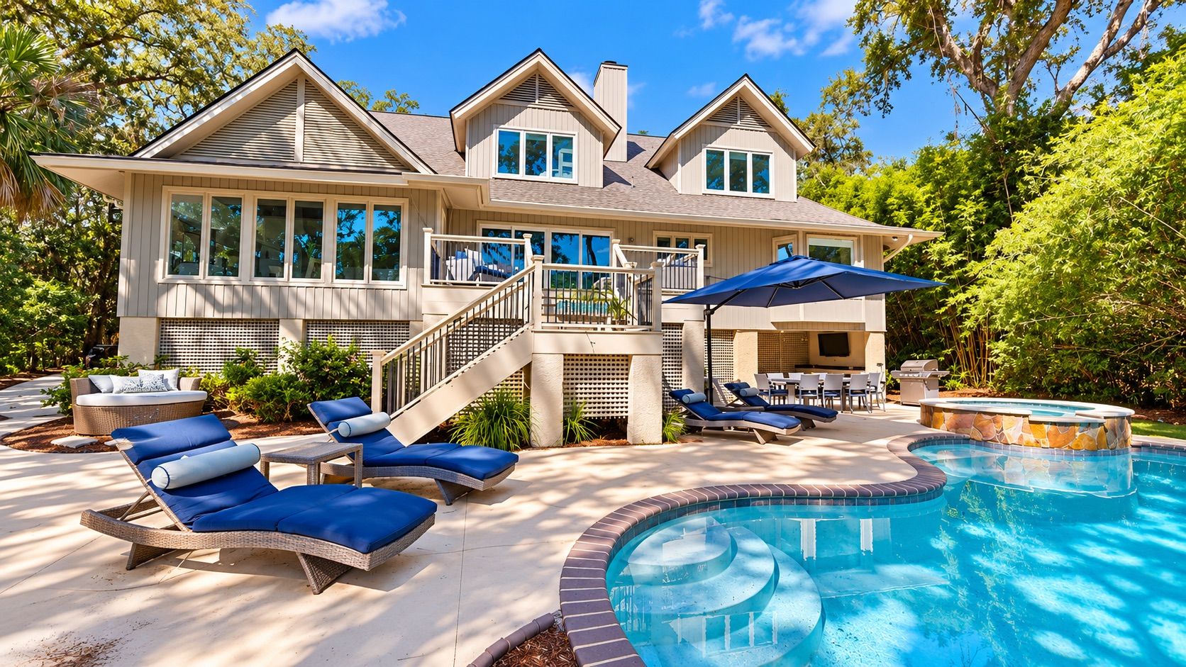 A house with a swimming pool, outdoor furniture, and a covered patio area.