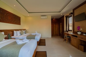 A hotel room with two beds, a desk, a TV, and a decorative wall piece. - Donald Ubud Cottages (Ubud)