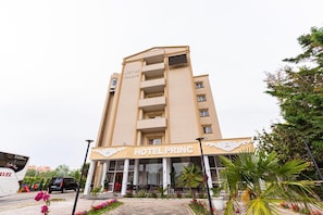 A multi-story hotel building with a sign reading 'HOTEL PRINC.' - Hotel Princ (Golem)