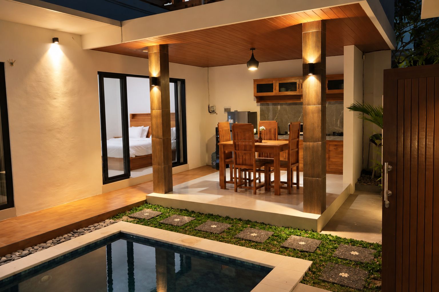 Un intérieur moderne comprenant un coin repas, une cuisine et une chambre.