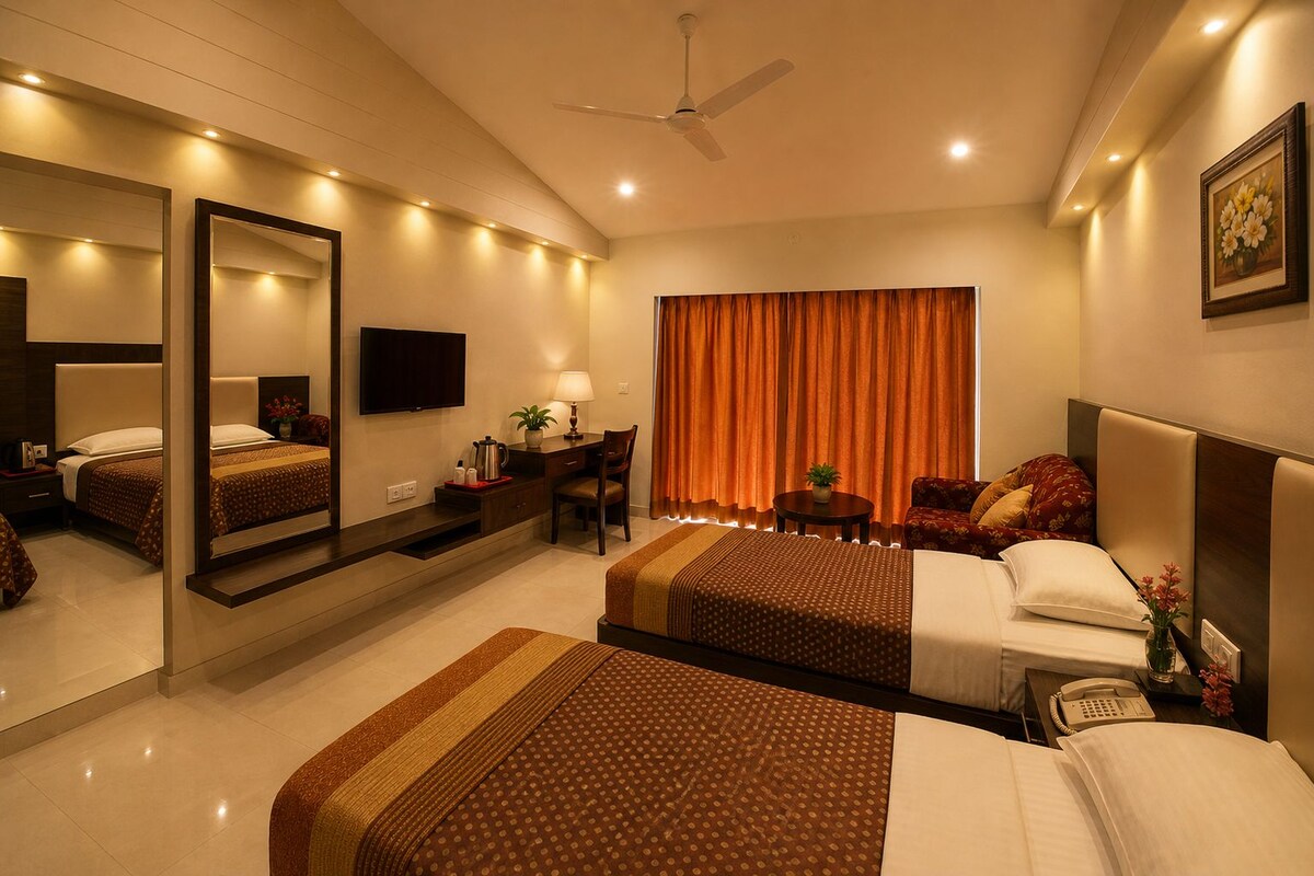 A hotel room with a large bed, a desk, a chair, a television, and a large window with curtains.
