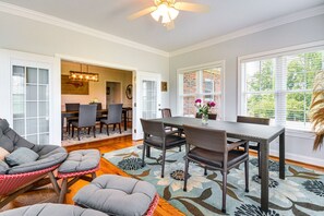 A spacious living area with a dining table, chairs, and a sofa. - Blue Ridge Views - Near Mt Airy & Wine Trail (Ararat)