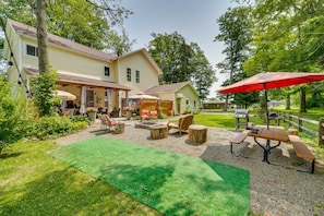 A residential property with a patio area, outdoor seating, and a barbecue grill. - Spacious Victorian Near Holiday Valley & Town (Ellicottville)