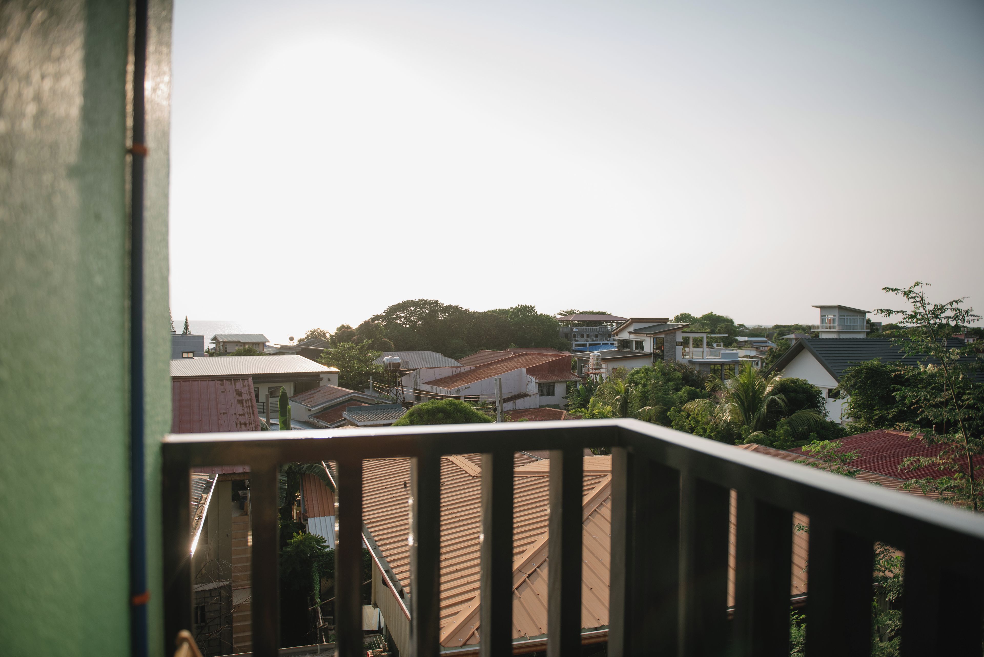 A residential area with various houses and a clear sky.