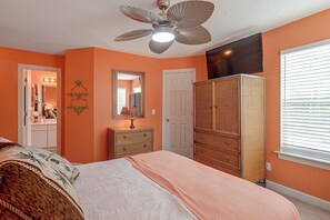 A bedroom with a bed, dresser, wardrobe, ceiling fan, and a mirror. - Murrells Inlet Condo: Close to Beaches, Amenities (Murrells Inlet)
