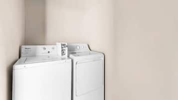 A laundry area with a front-loading washer and dryer.