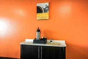 A small kitchenette with a coffee machine, a kettle, and a salt shaker on the counter. - 1 King Bed | Mobil Access Tub Nsmk Micfridg (New Braunfels)