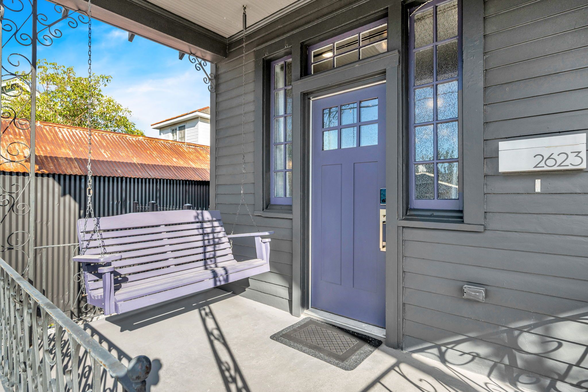 Relax on the front porch swing by the welcoming entry