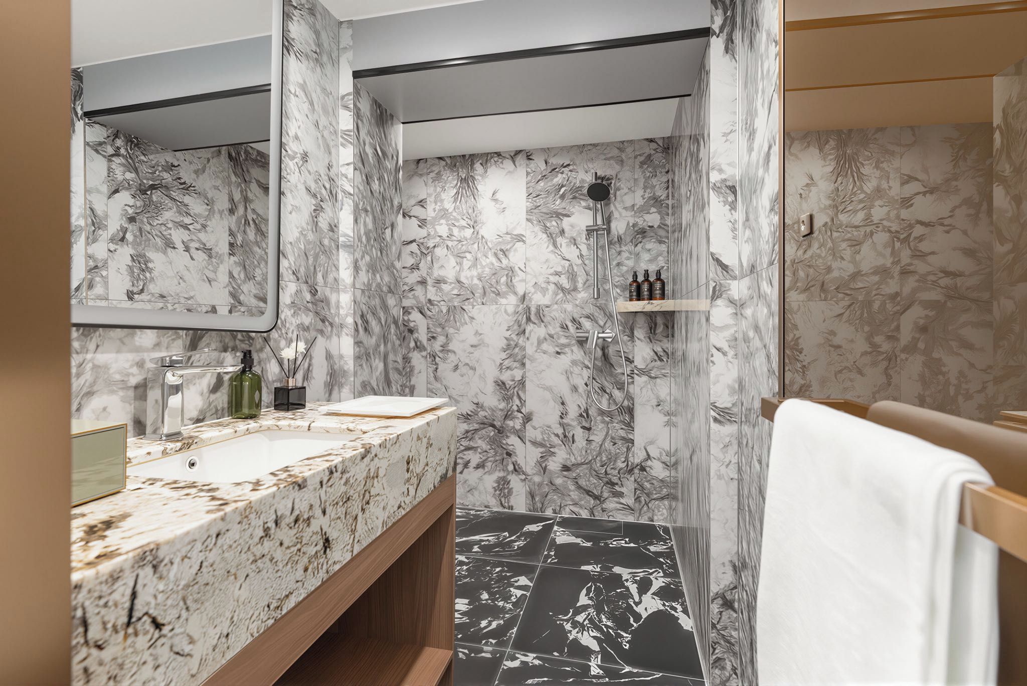 Une salle de bain avec un meuble-lavabo en marbre, une douche et un porte-serviettes.