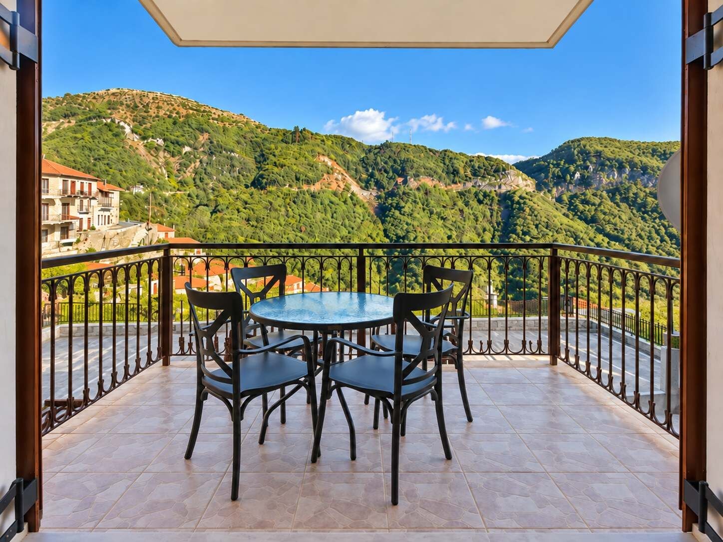 Balcony overlooking the green mountain landscape.