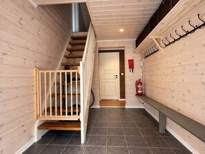 A wooden interior with a staircase, a fire extinguisher, and a bench. - Mountain View at Gol Ski Resort with Sauna (Gol)