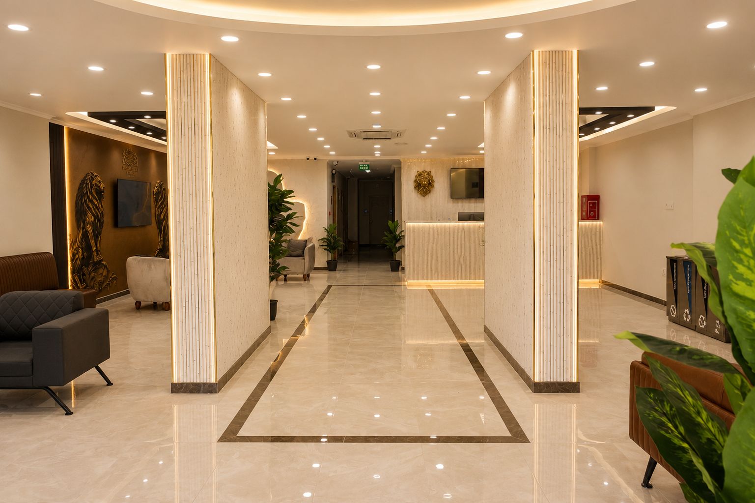 A hotel lobby with a reception desk, seating area, and a modern design.