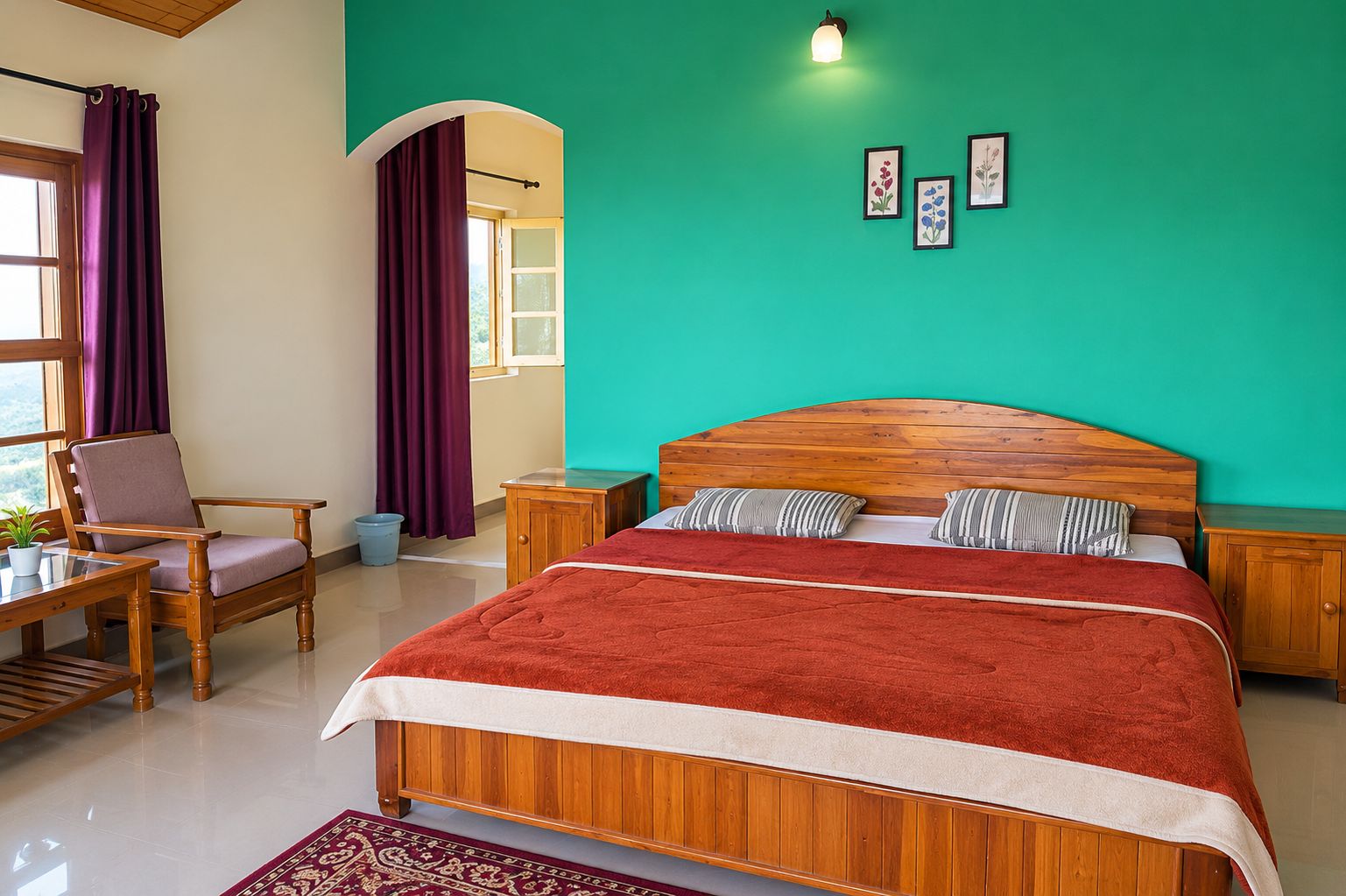 A bedroom with a wooden bed, a chair, a small table, a window with curtains, and a green wall.