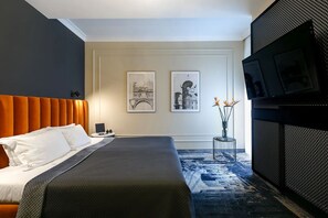 A hotel room with a large bed, a television, and two framed pictures on the wall. - Classic Room | 1 King Bed | 0.8 Mi To Kazimierz Jewish District, Free Breakfast (Kraków)