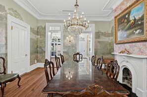 Dining Area | Chandelier | Fireplace & Wall Mural - Historic Savannah Estate by Forsyth Park (Savannah)