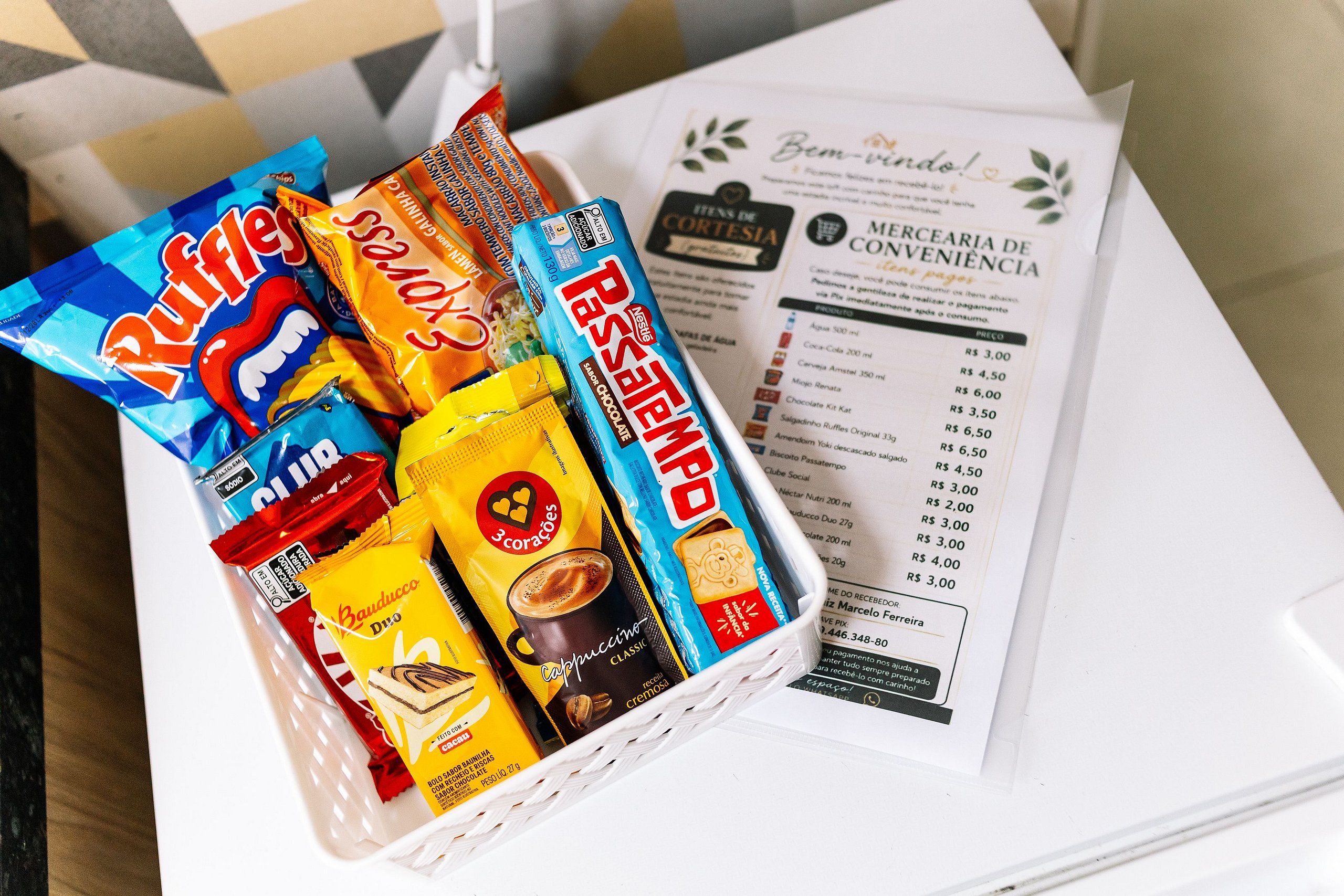 A basket containing various snack items and a receipt.